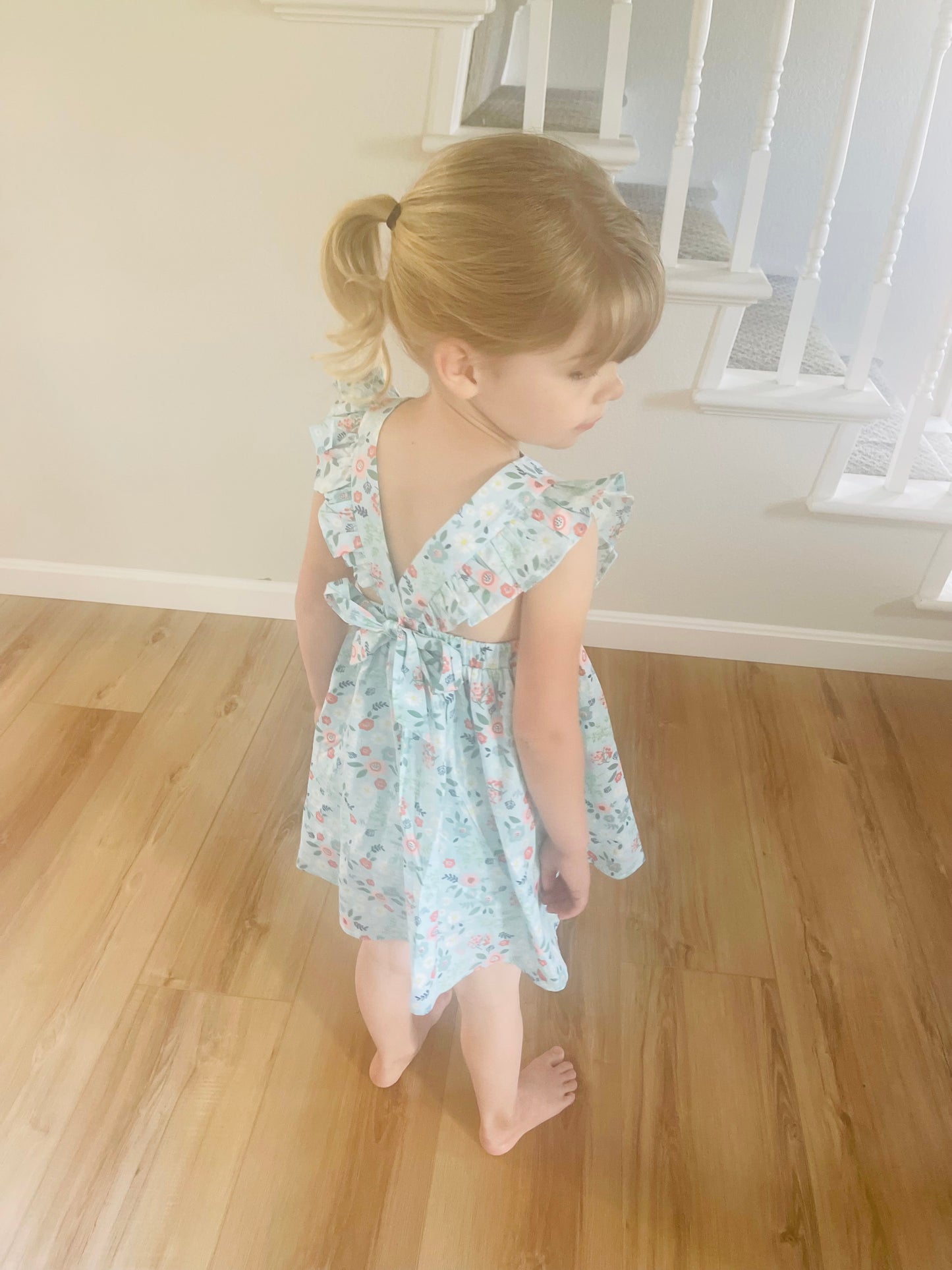 L.W. Clothing Company Blue Floral Girls Dress with Ruffle Sleeves and Open Tie Back